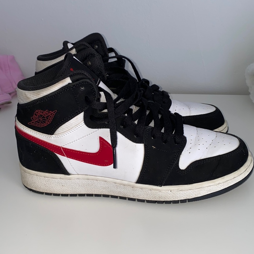 Black and white jordan 1s